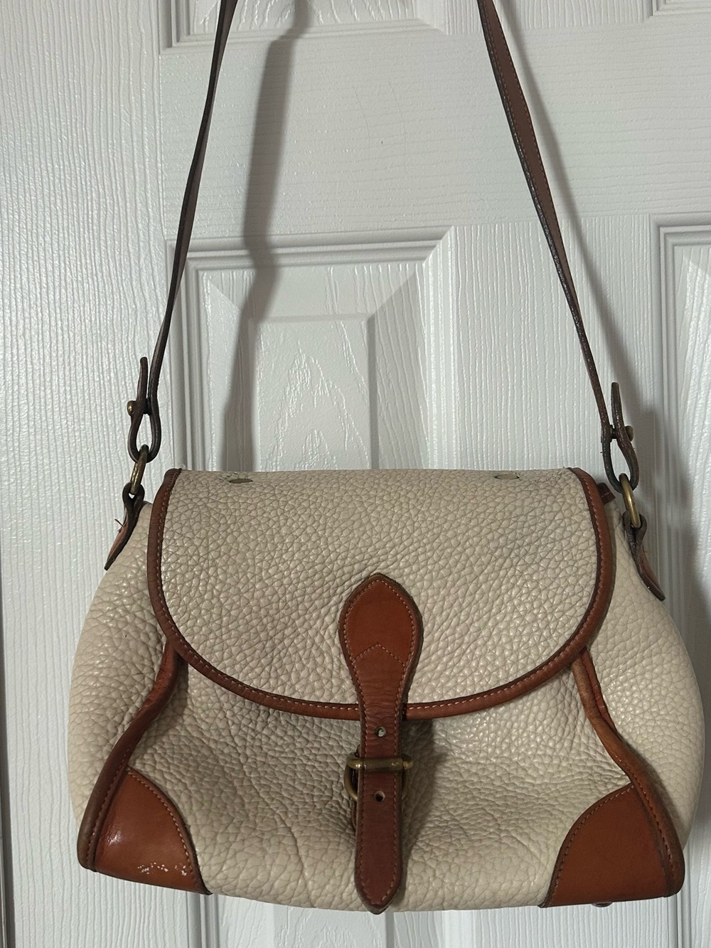 Classic Cream Pebbled Leather Shoulder Bag with Brown Trim
